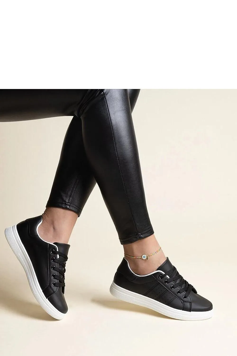 White sneakers with a black element